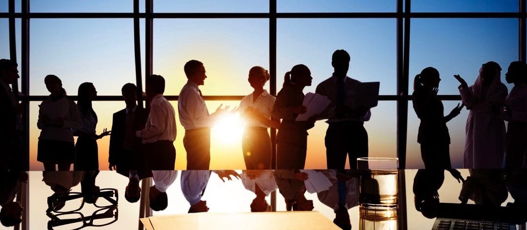 Silhouettes of Business People Working in Board Room