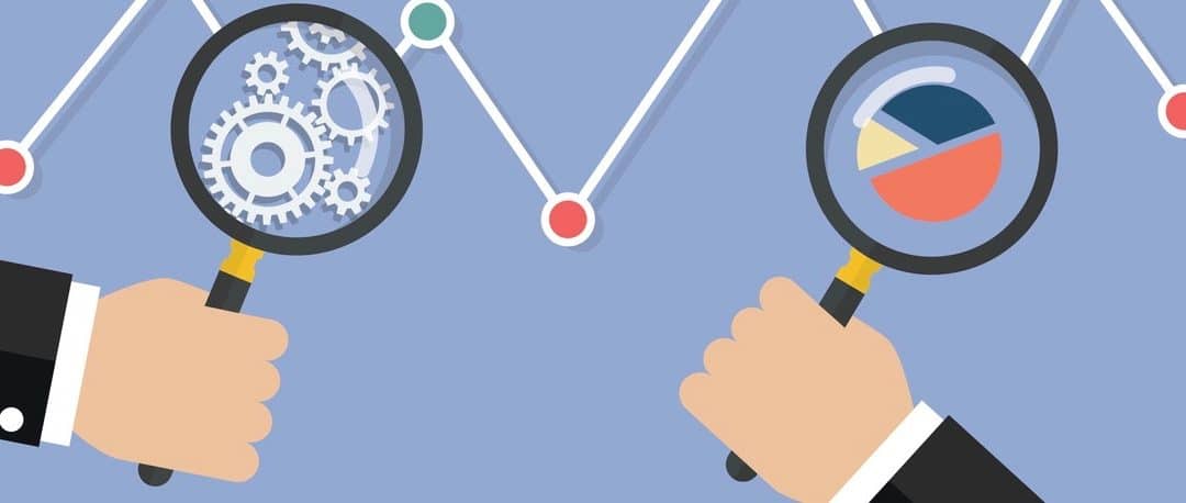 Hands holding magnifying glass for data analysis.