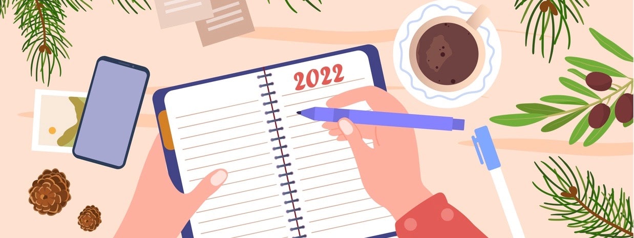 New Year goals and resolutions concept. Woman writes down her dreams and plans for future in notebook.