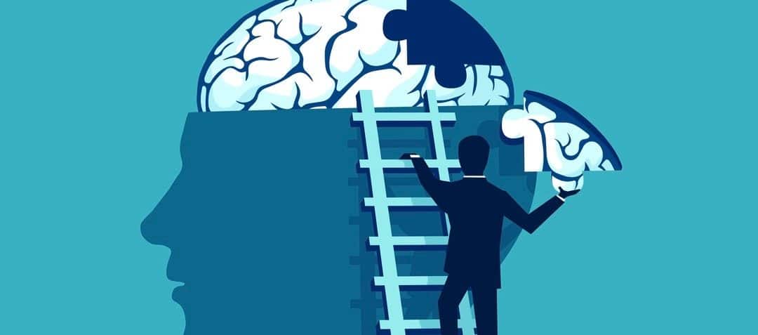 Business man climbing up the stairs reaching human head to add piece of brain puzzle.